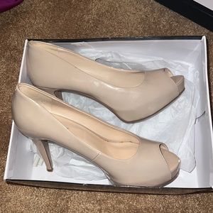 Perfect nude pumps fur any business or casual event. No signs of major wear.